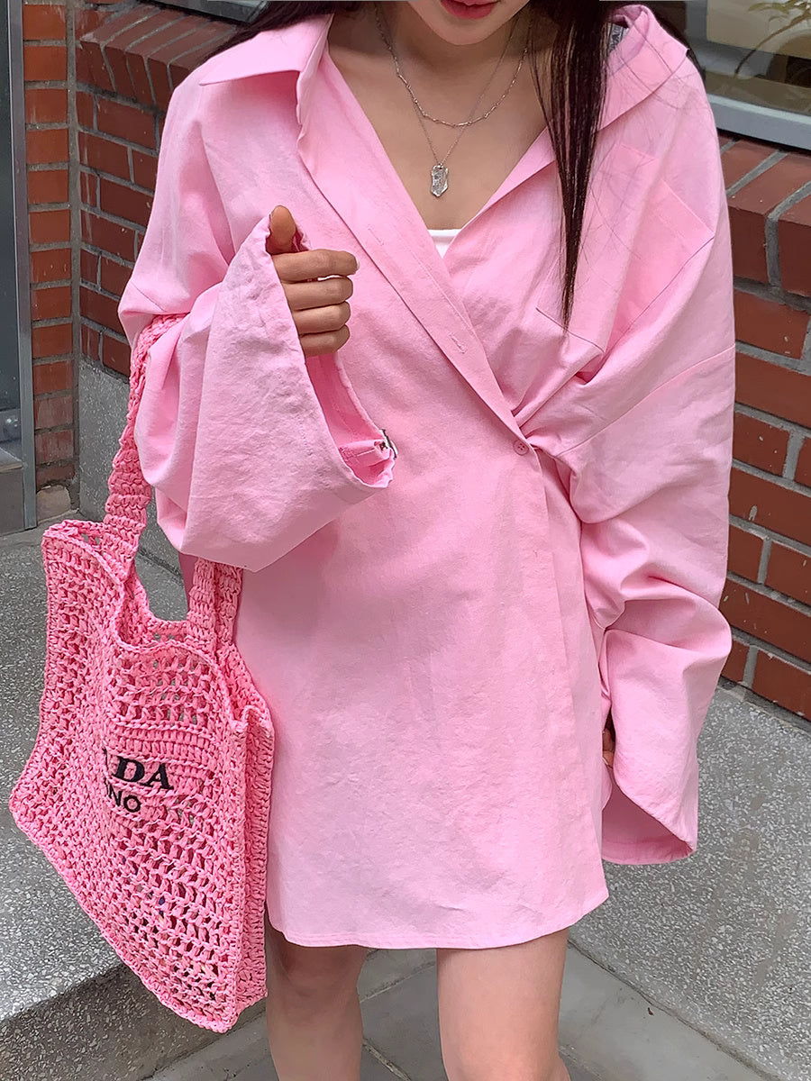 Sunkissed summer outfit for women featuring a light pink wrap dress and matching crochet tote bag