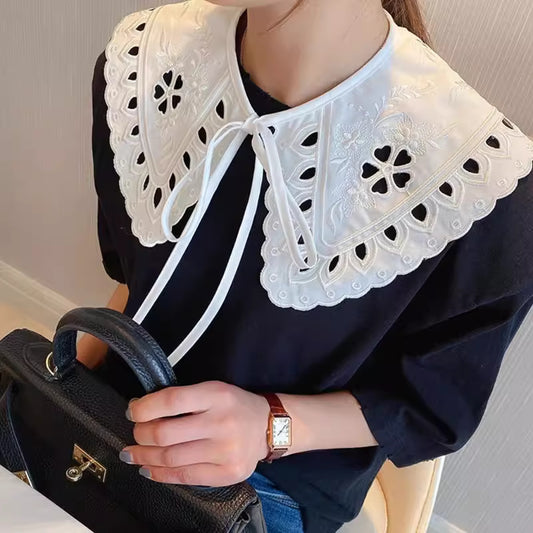 Orchid Moda trendy faux collar for women with intricate embroidery and scalloped edges worn over a black top