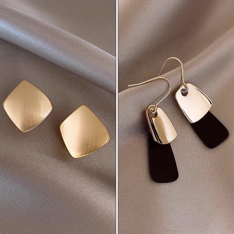 Orchid Moda trendy geometric earrings for women in gold finish with modern minimalist design on satin background