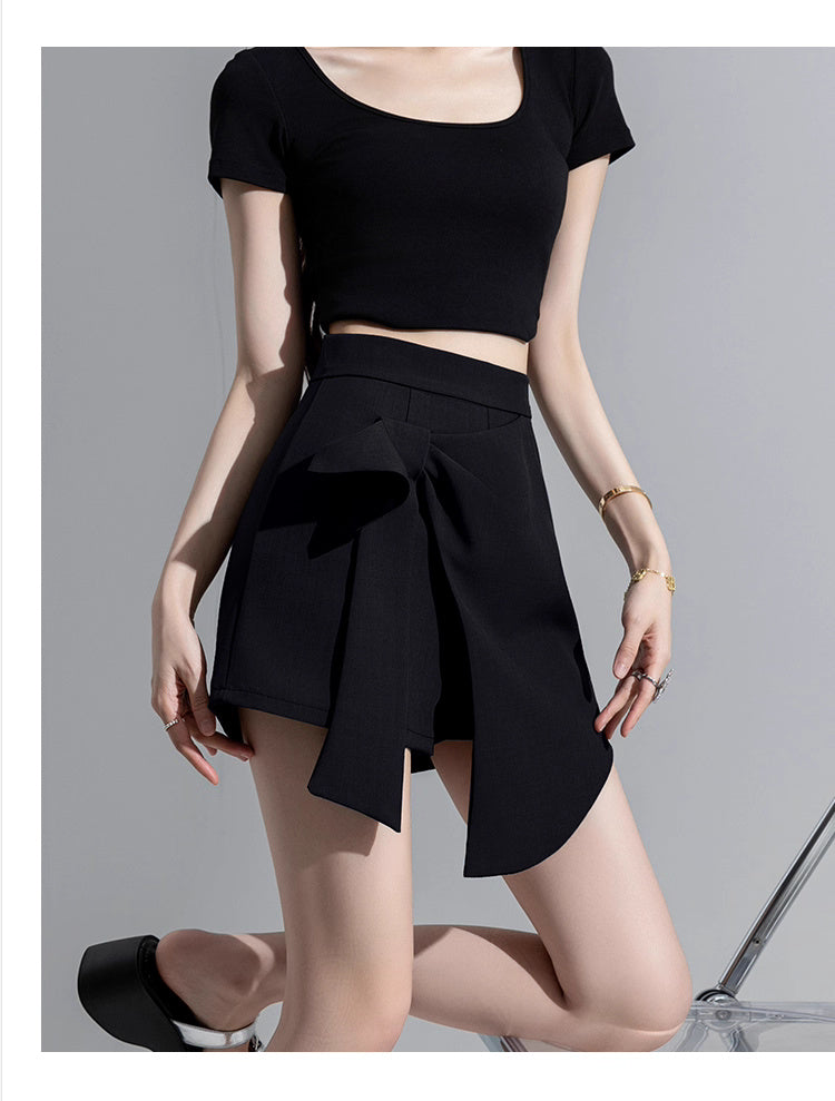 Orchid Moda trendy high waisted skort in black paired with a black crop top and black heels