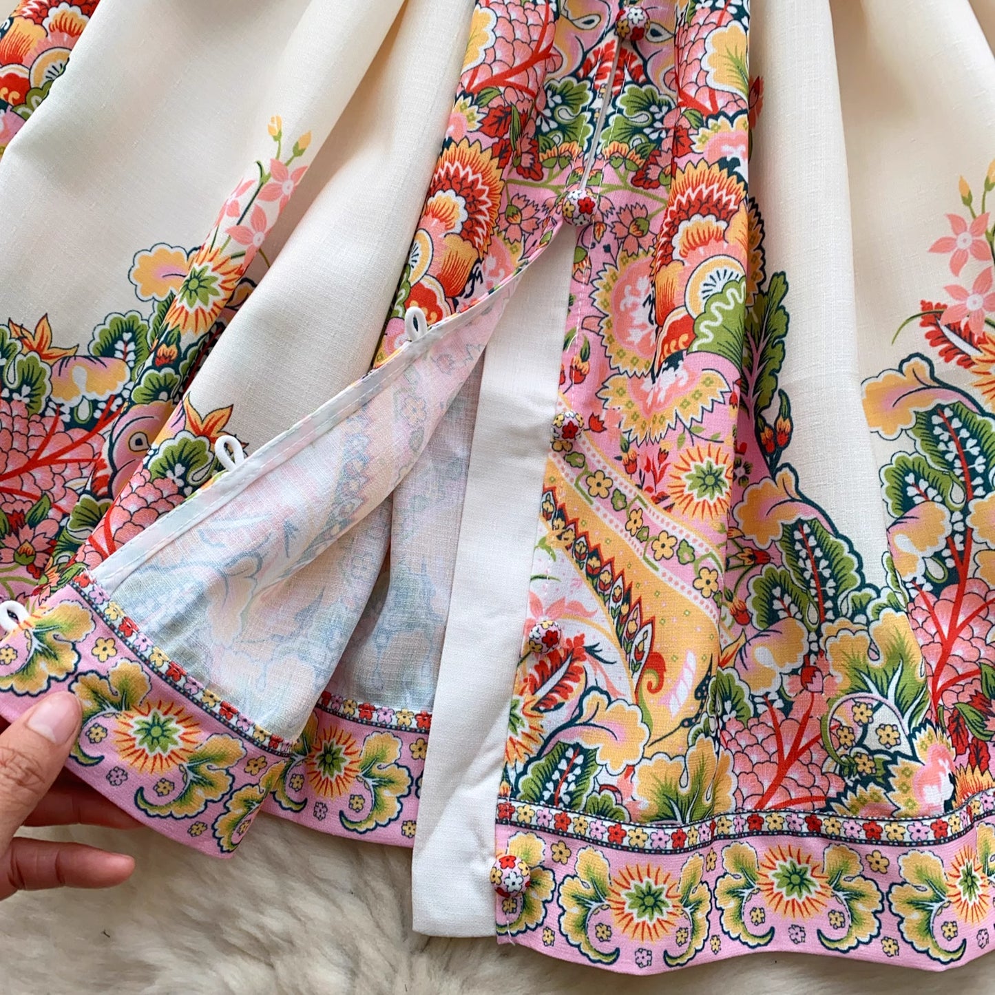 Orchid Moda trendy weekender dress for women with colorful floral and paisley print fabric close-up