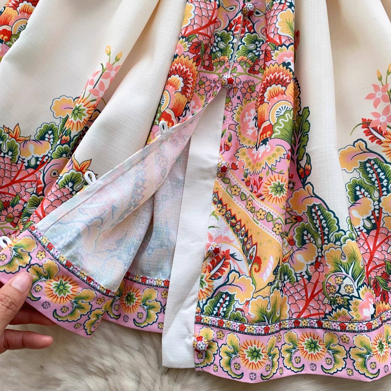 Orchid Moda trendy weekender dress for women with colorful floral and paisley print fabric close-up