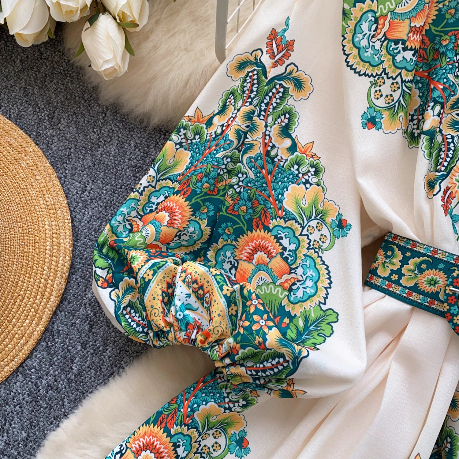 Close-up of colorful floral patterned sleeve on trendy weekender dress for women by Orchid Moda