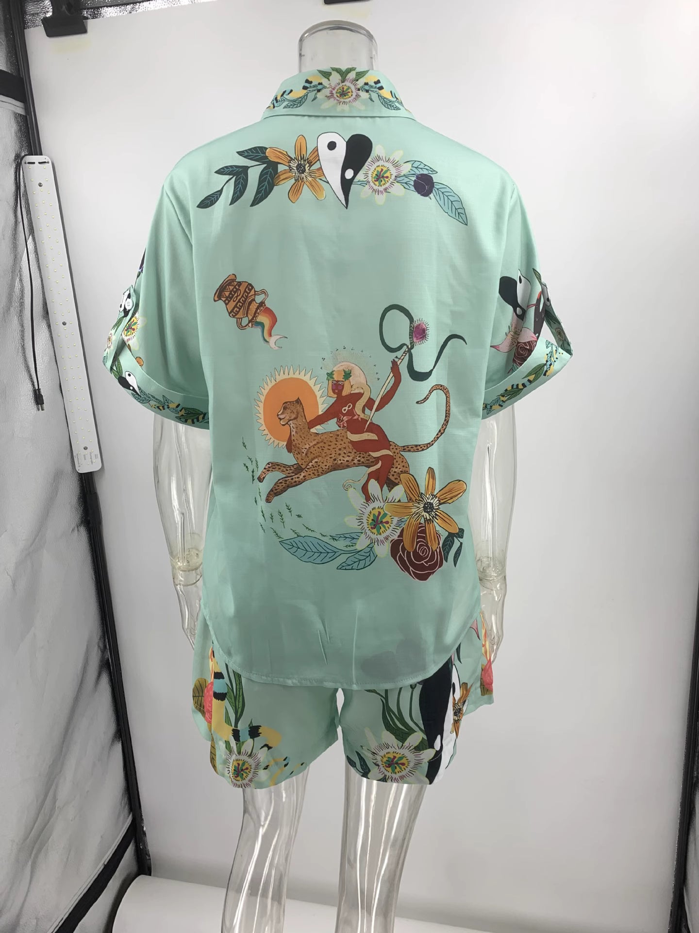 Orchid Moda tropical co-ord set for women in light green with colorful floral and animal print design