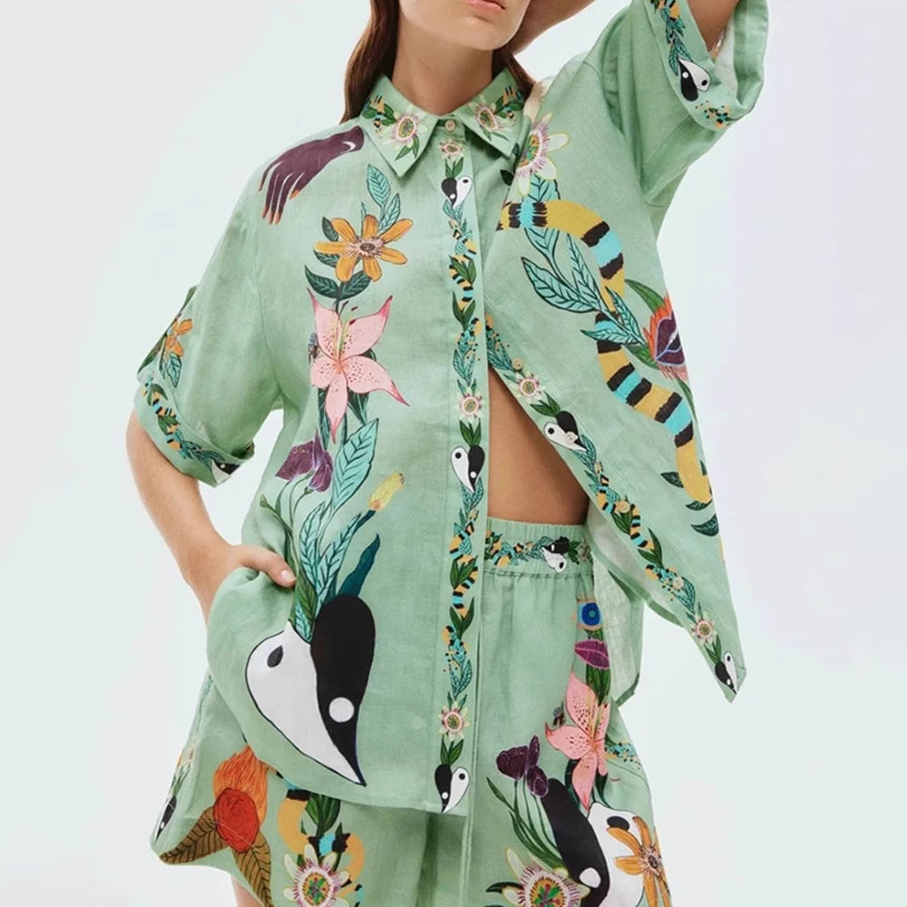 Orchid Moda tropical co-ord set for women with green floral and bird print shirt and matching shorts