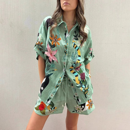 Orchid Moda green tropical co-ord set for women featuring floral and bird prints with shorts and short-sleeve button-up top