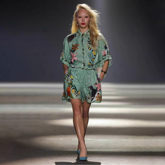 Model wearing a green floral tropical co-ord set for women featuring a button-up top and matching shorts