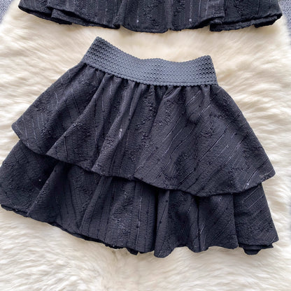 Black skirt detail from beaded co ord set for women by Orchid Moda with textured waistband and layered fabric