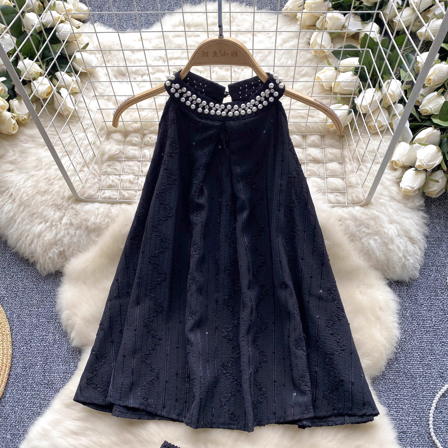 Black sleeveless top with pearl necklace detail from beaded co ord set for women by Orchid Moda