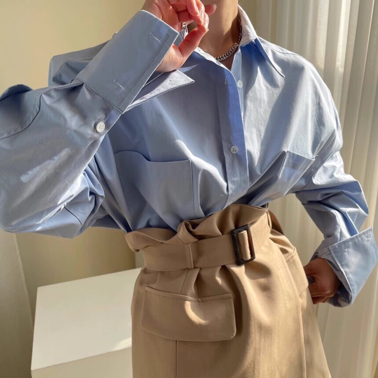 Orchid Moda closet raid oversized shirt and skirt set featuring a light blue oversized shirt and beige high-waist belted skirt