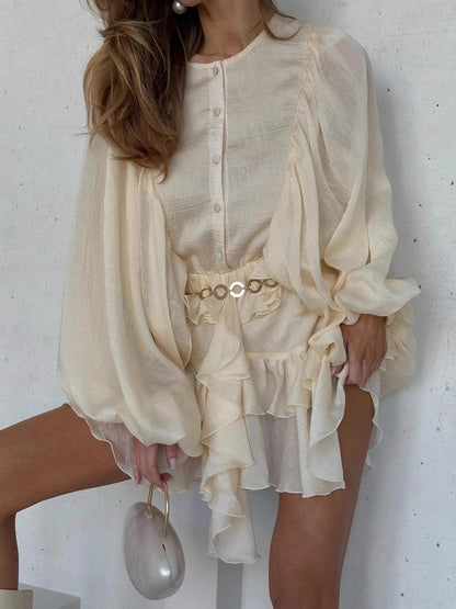 Orchid Moda beige elegant lantern sleeve dress with ruffles and gold belt detailing