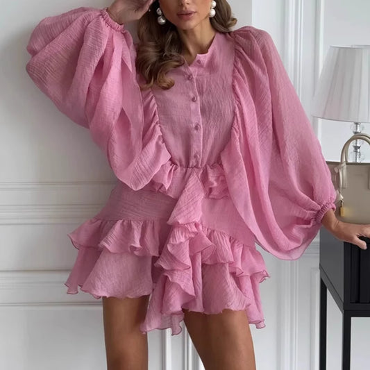 Pink elegant lantern sleeve dress with ruffle hem and button-up front by Orchid Moda