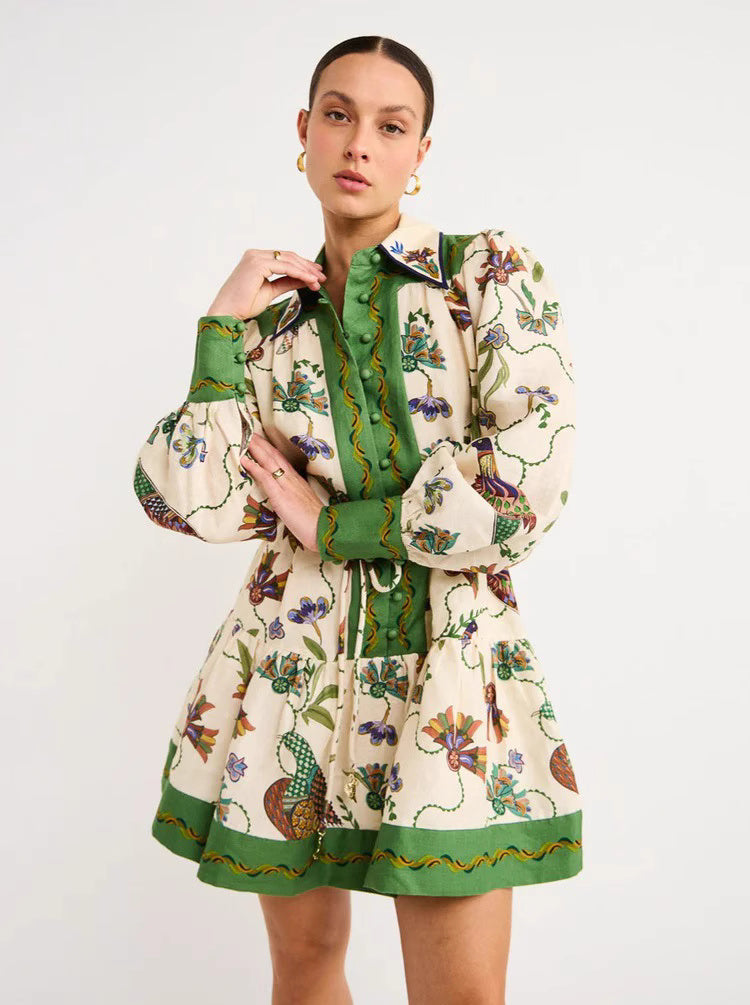 Orchid Moda peacock print lantern sleeve dress with green accents and detailed floral design