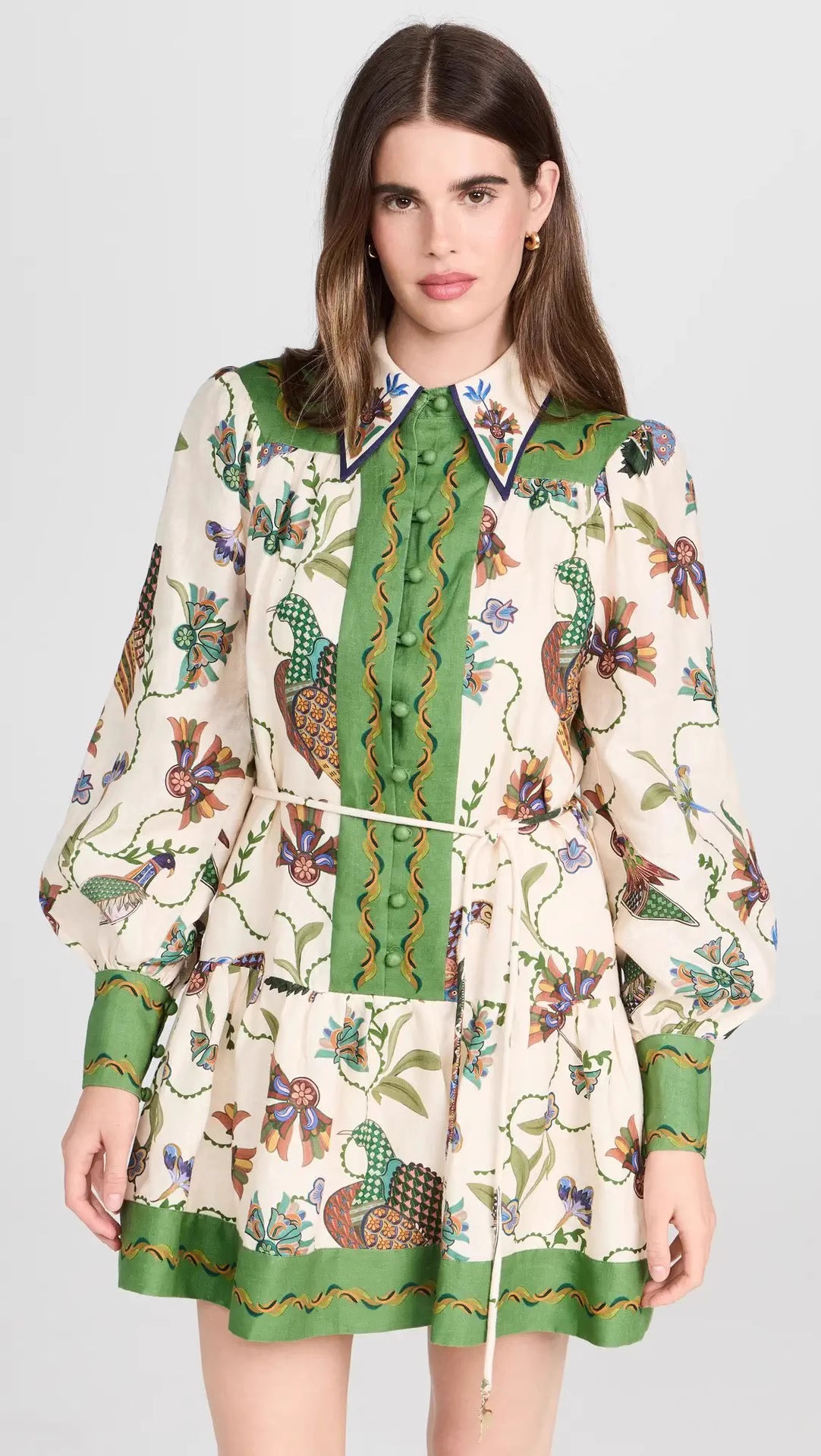 Orchid Moda peacock print lantern sleeve dress with green accents and floral patterns