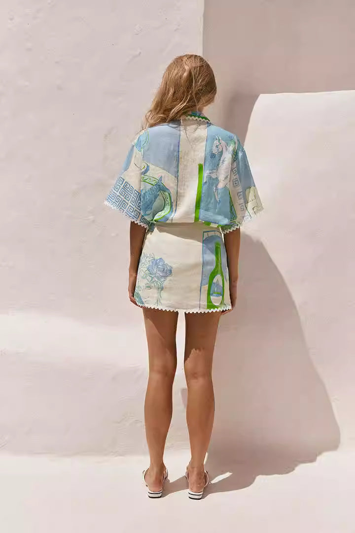 Back view of woman wearing a printed co-ord set for women with blue and green artistic patterns