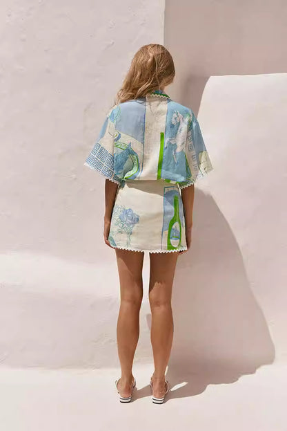 Back view of woman wearing a printed co-ord set for women with blue and green artistic patterns
