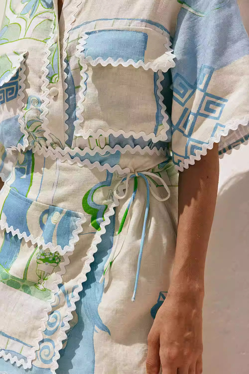 Orchid Moda printed co-ord set for women featuring blue and green abstract patterns with decorative trim details