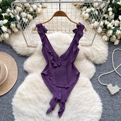 Purple ruffled cami top for women with deep V-neck and tie front detail by Orchid Moda