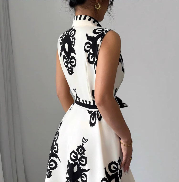 Back view of Soho Stroll shirt dress by Orchid Moda in white with bold black floral print and sleeveless design