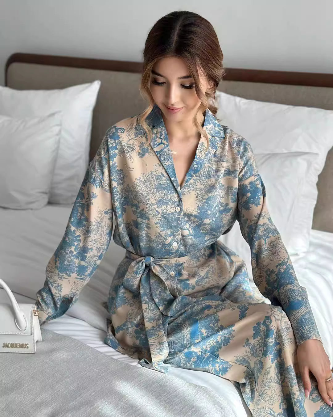 Orchid Moda women's co ord set with blue and beige floral pattern featuring a belted waist and button-up design