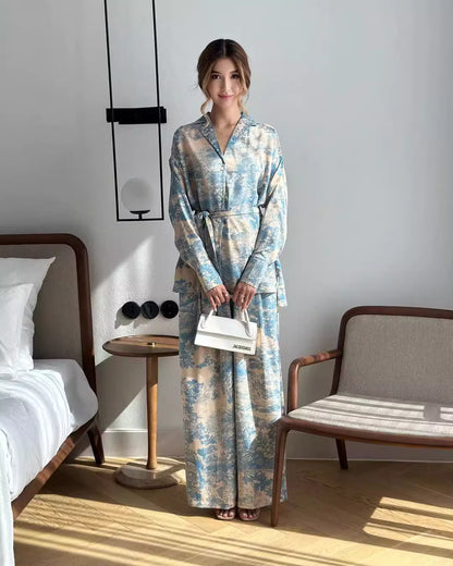 Orchid Moda women's co ord set with blue and beige floral print, long sleeves, and matching wide-leg pants