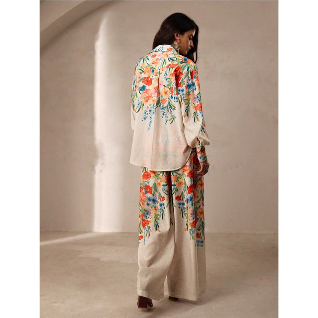 Orchid Moda womens floral co ord set featuring long sleeve top and wide leg pants with colorful floral print