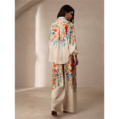 Orchid Moda womens floral co ord set featuring long sleeve top and wide leg pants with colorful floral print