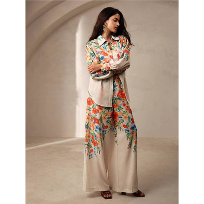 Orchid Moda womens floral co ord set featuring a cream base with vibrant orange and blue floral patterns